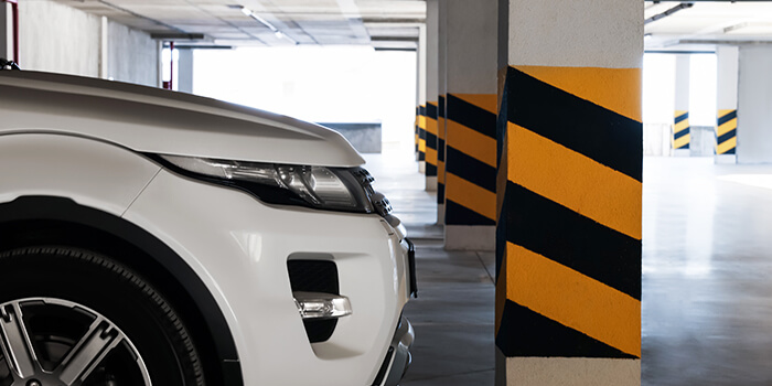 Car parked by itself in a public garage